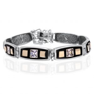 Geometrisches Armband mit Zirkonia & Goldakzenten<br /><h4><span class="OYPEnA font-feature-liga-off font-feature-clig-off font-feature-calt-off text-decoration-none text-strikethrough-none">(925er Sterlingsilber, 9kt Gold & Cubic Zirkonia)</span></h4>
